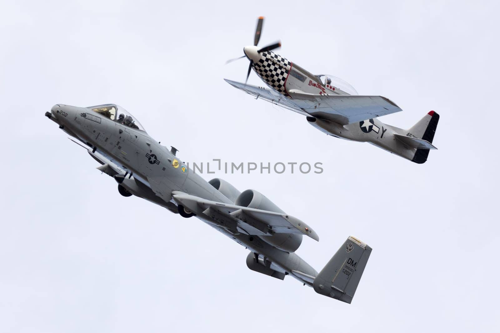 Louisville, Kentucky, USA - April 21, 2018 A-10 Thunderbolt and a P-51 Mustang in formation at the Thunder Over Louisville