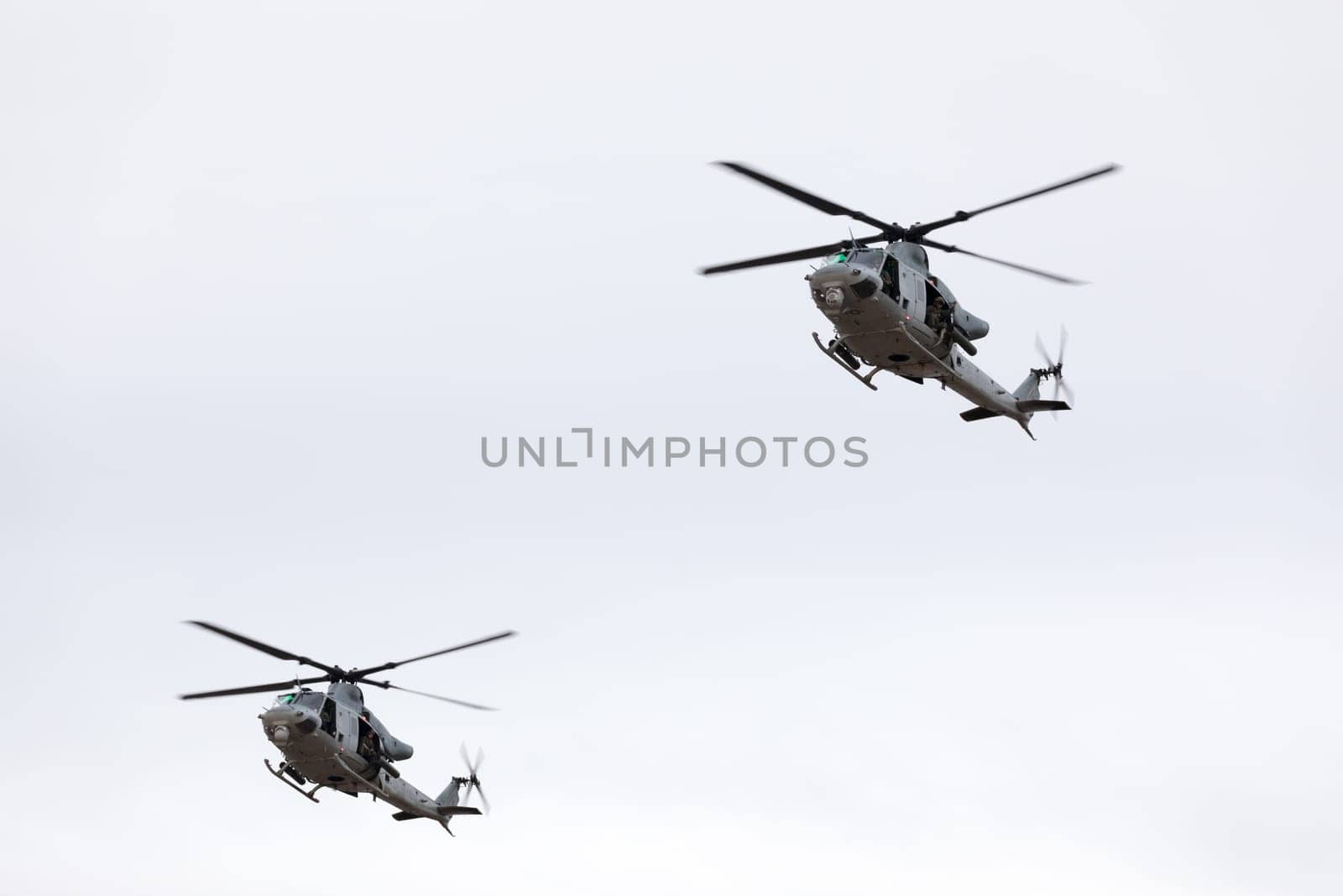 Louisville, Kentucky, USA - April 21, 2018 UH-1 Iroquois transport helicopters in formation fly by at the Thunder Over Louisville