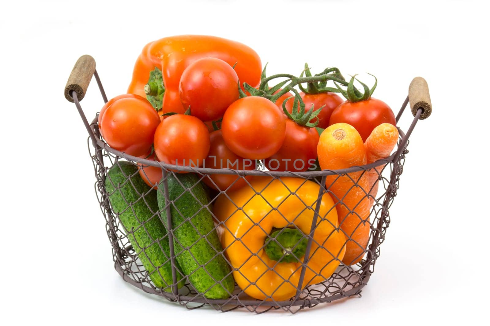 basket with fresh vegetables on white background