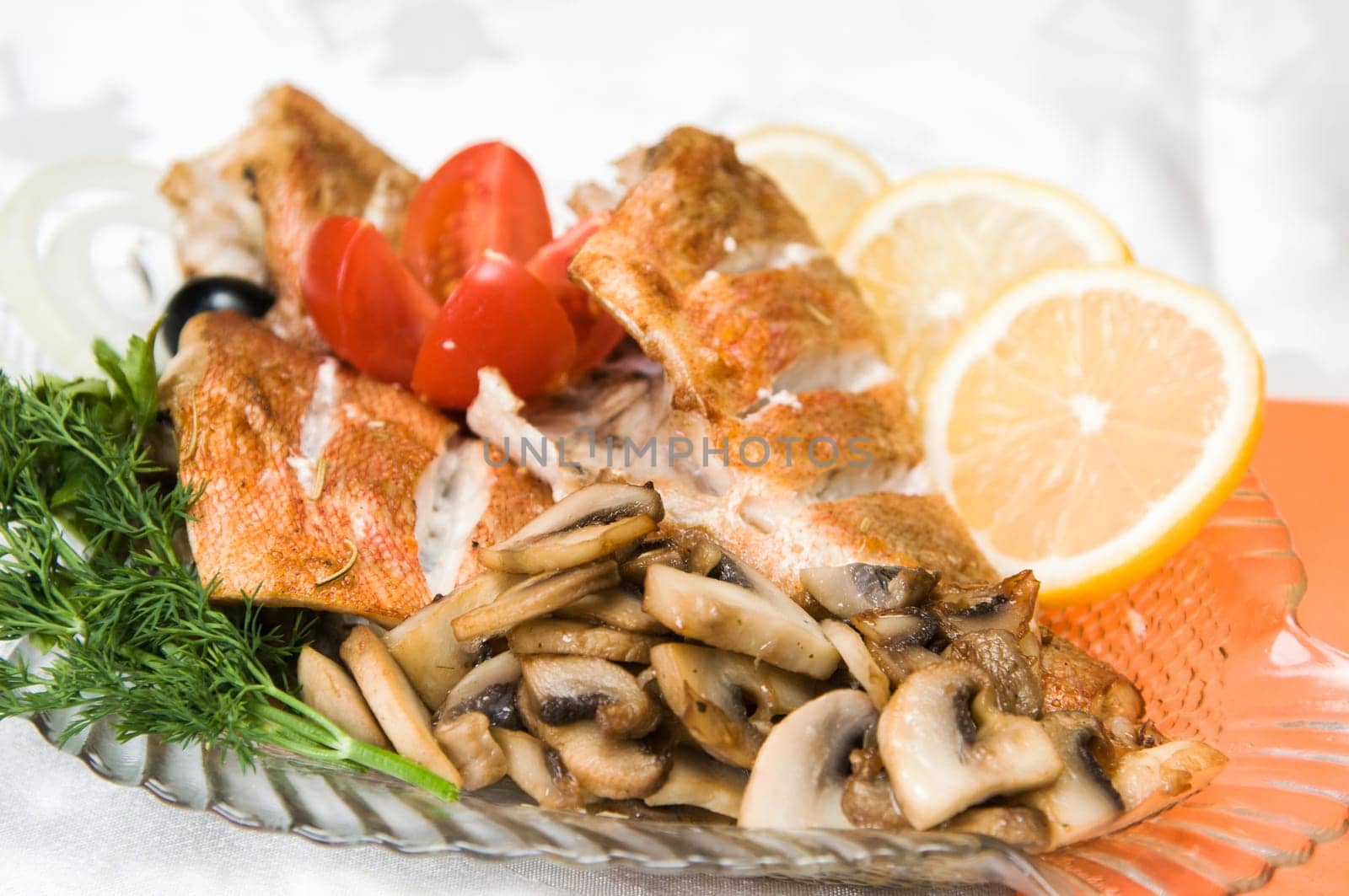 Sea bass fillet with mushrooms, lemon and greens