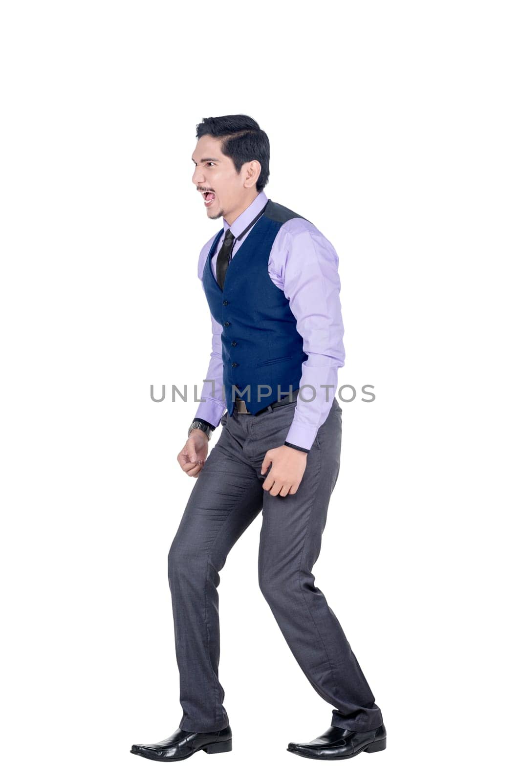 Expressive asian businessman in formal suit standing isolated over white background