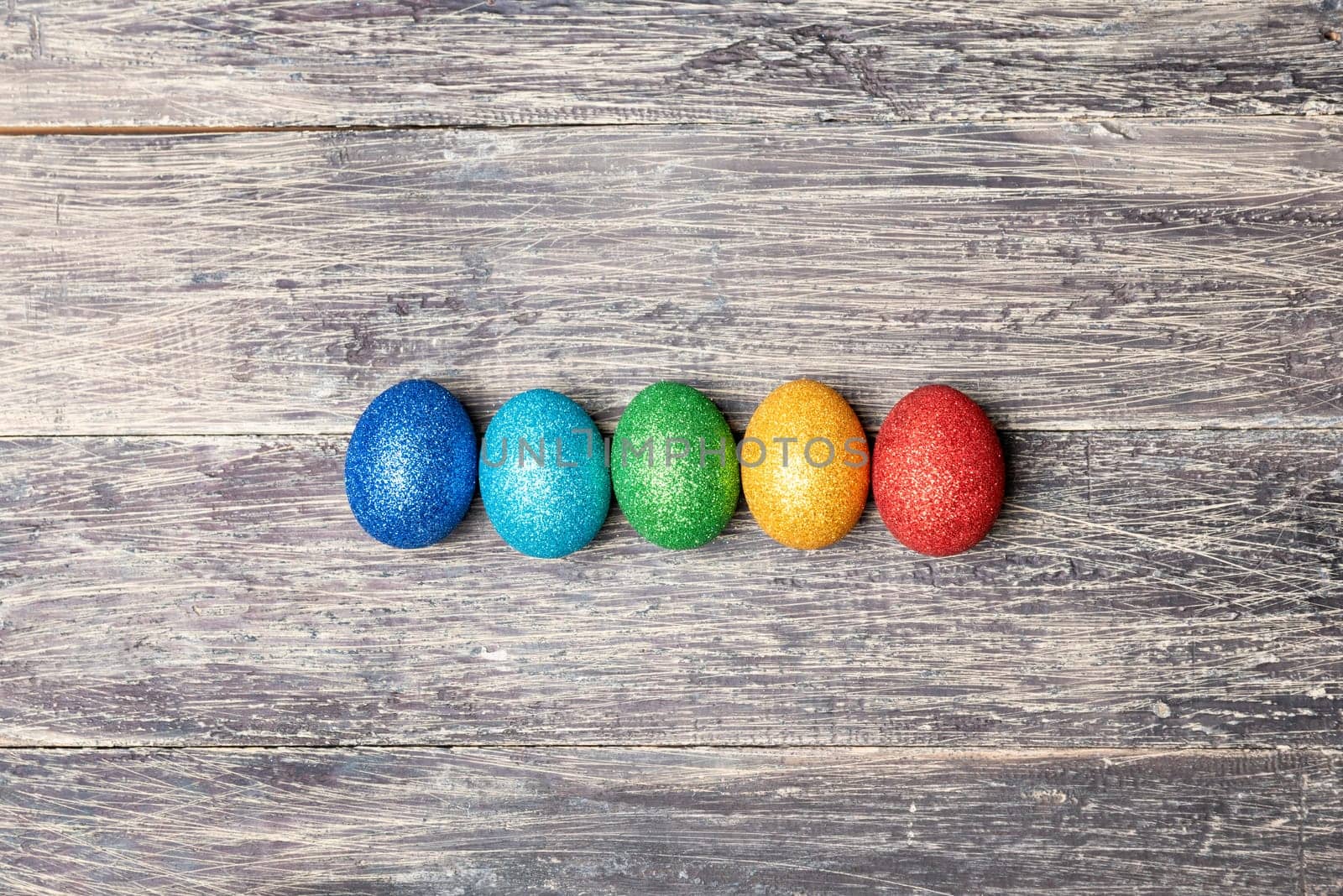 Colorful easter eggs on wooden table. Happy Easter