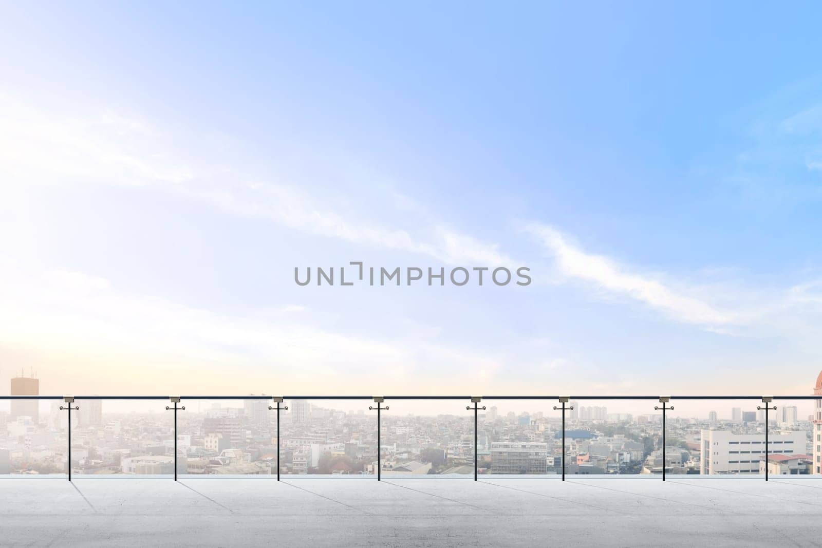 Empty modern terrace area with city view over blue sky background