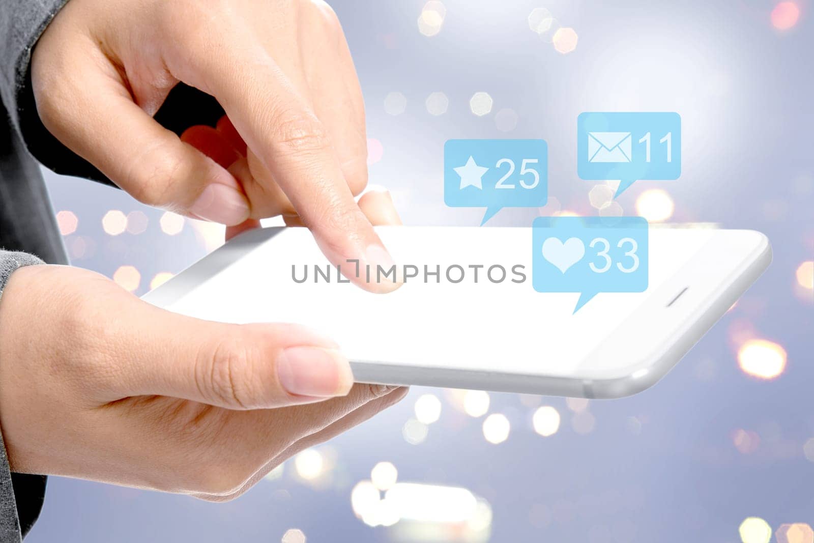 Business woman touching the mobile phone screen with notification of message, likes and important things over blurred light background