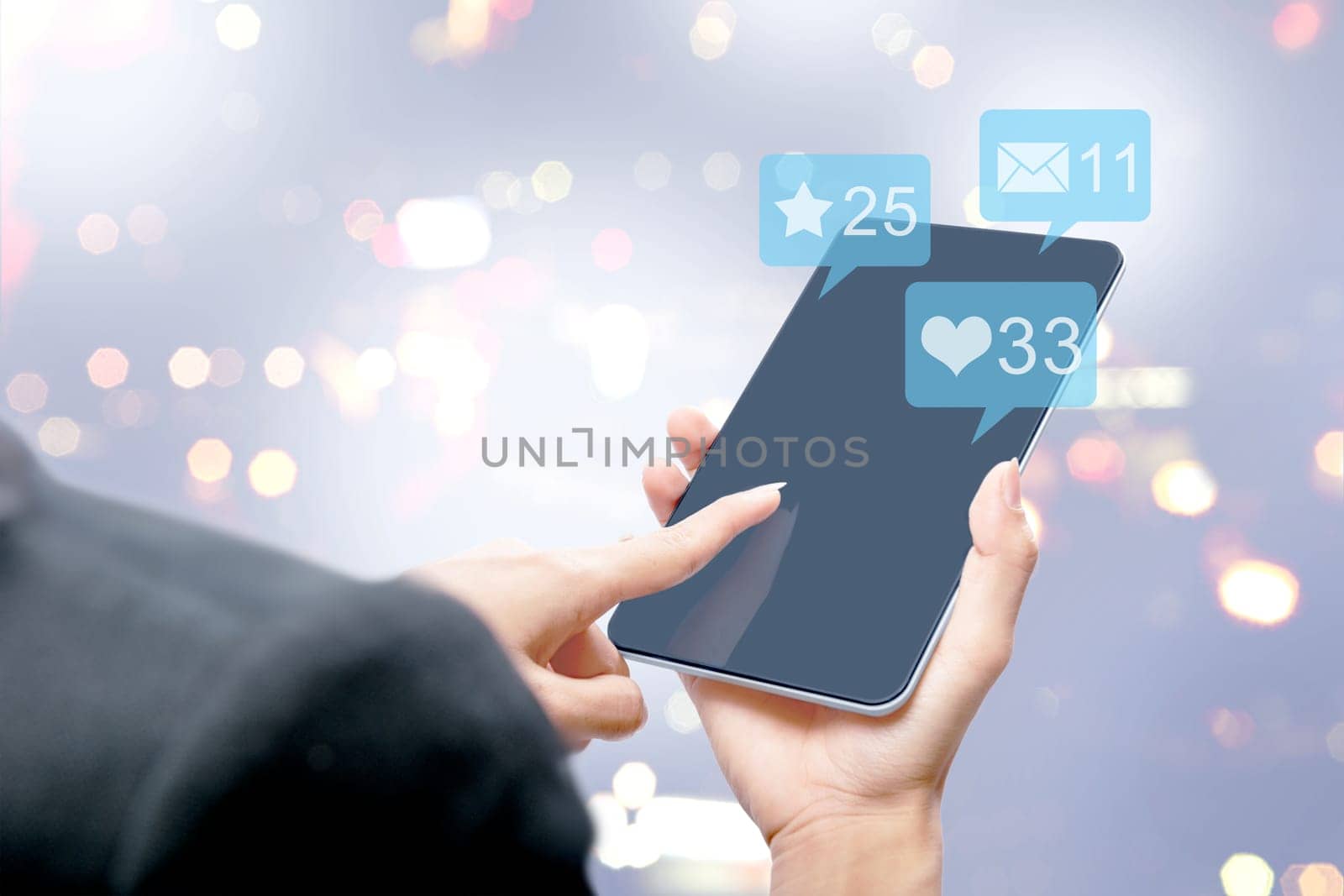 Business woman touching the tablet screen with notification of message, likes and important things over blurred light background