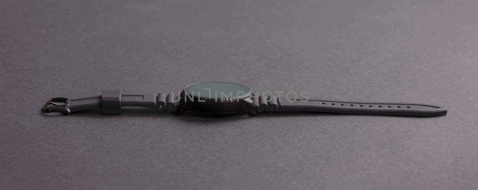 Black smartwatch isolated on a black background