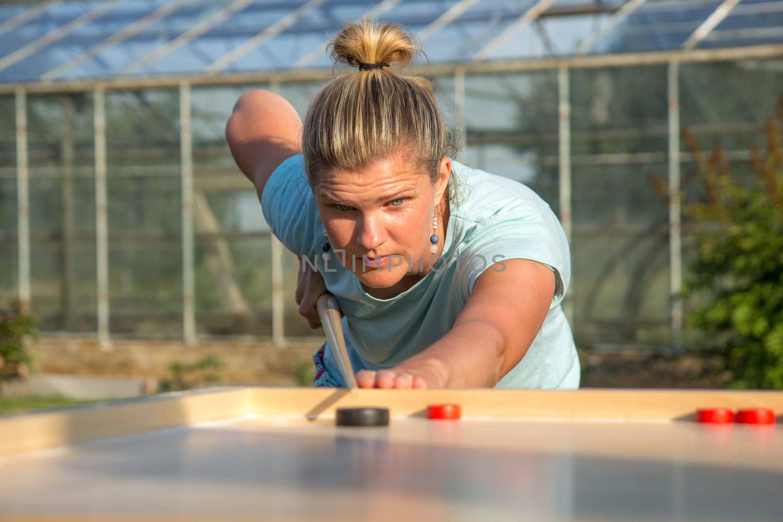 Women playing Novuss in outdoors. Novuss is a national sport in Latvia similar to pocket billiards or pool.