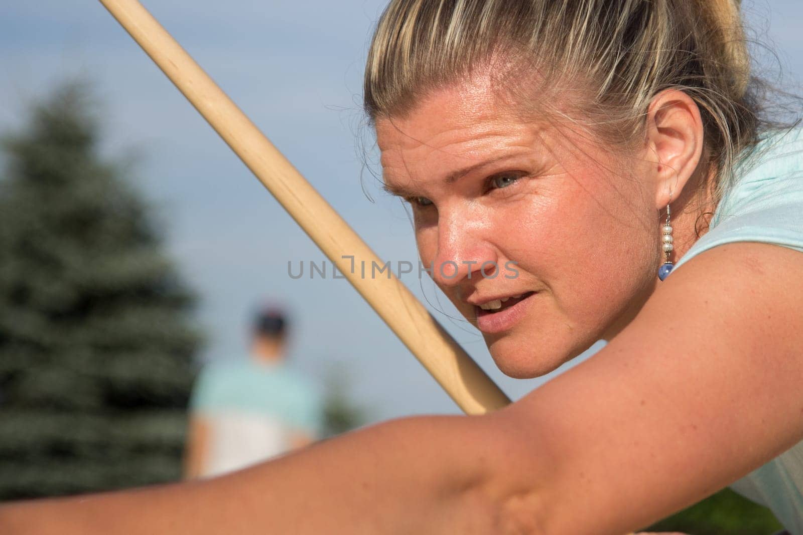 Women playing Novuss in outdoors. Novuss is a national sport in Latvia similar to pocket billiards or pool.