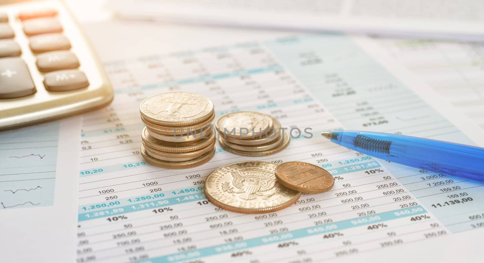 Coins on documents with a calculator