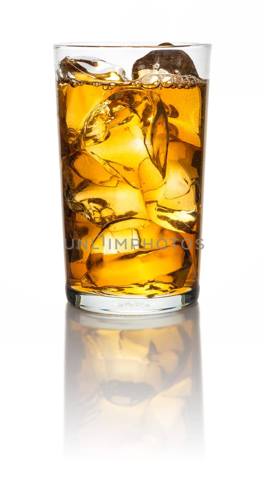 A glass with iced tea and icecubes on a white background