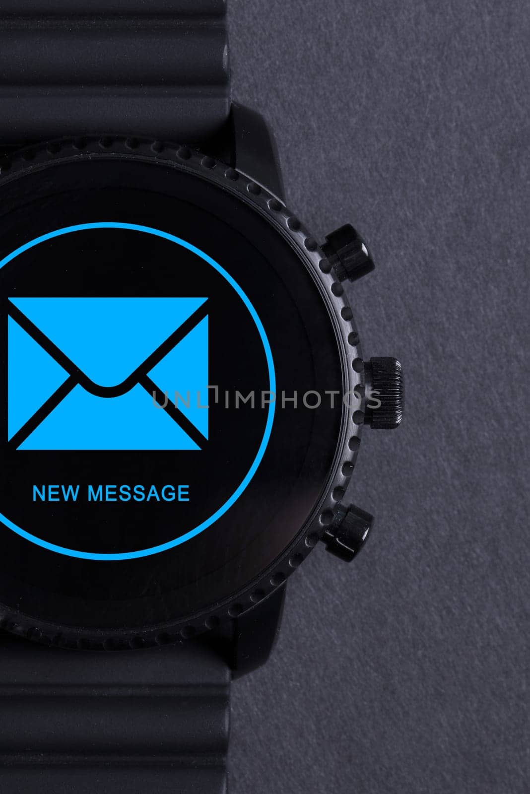 Black smartwatch isolated on a black background, new message