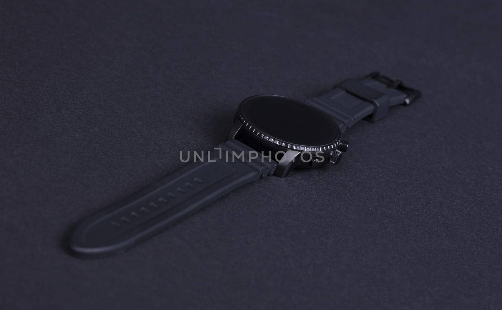 Black smartwatch isolated on a black background