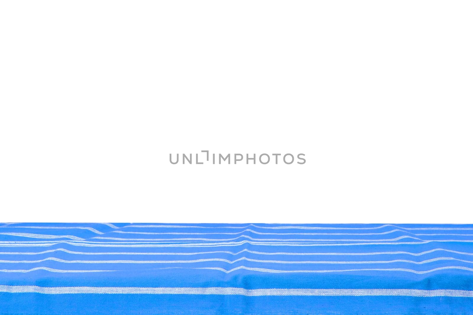 Empty wooden table isolated. Empty wooden deck table with blue striped tablecloth isolated on a white background. Template for your food and product display montage.