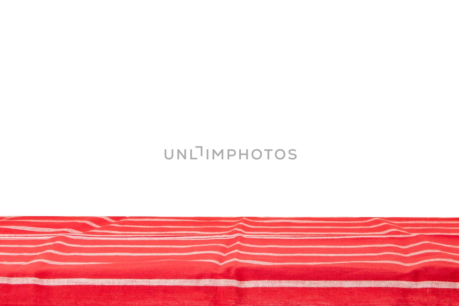 Empty wooden table isolated. Empty wooden deck table with red striped tablecloth isolated on a white background. Template for your food and product display montage.