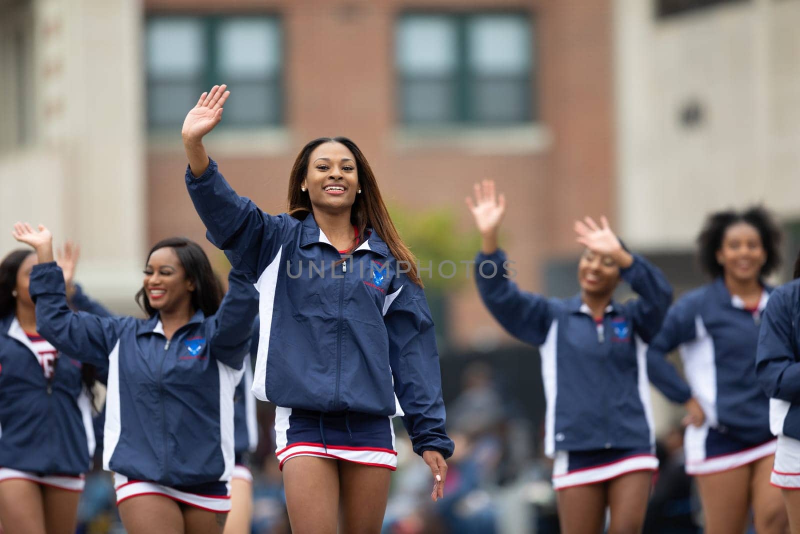 Indianapolis, Indiana, USA - September 22, 2018: The Circle City Classic Parade, African american cheerleader from Howard University Bison Cheerleading walking down the street parade