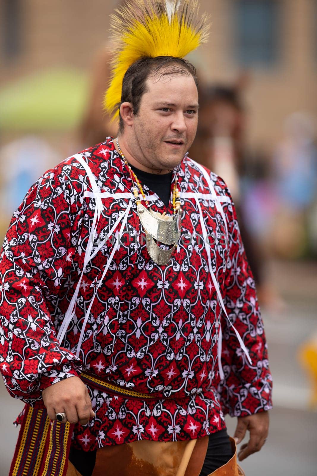 Peru, Indiana, USA - July 21, 2018 Man wearing a native american outfit at the Circus City Festival Parade