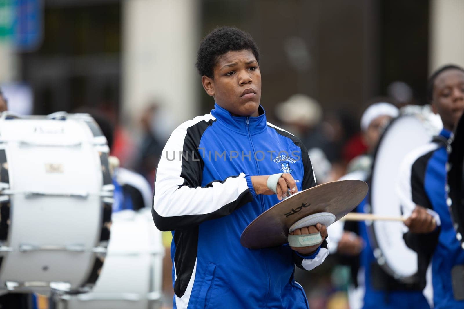 Indianapolis, Indiana, USA - September 22, 2018: The Circle City Classic Parade, young man from the North Division High School Blue Devils marching band playing the Hand Cymbals