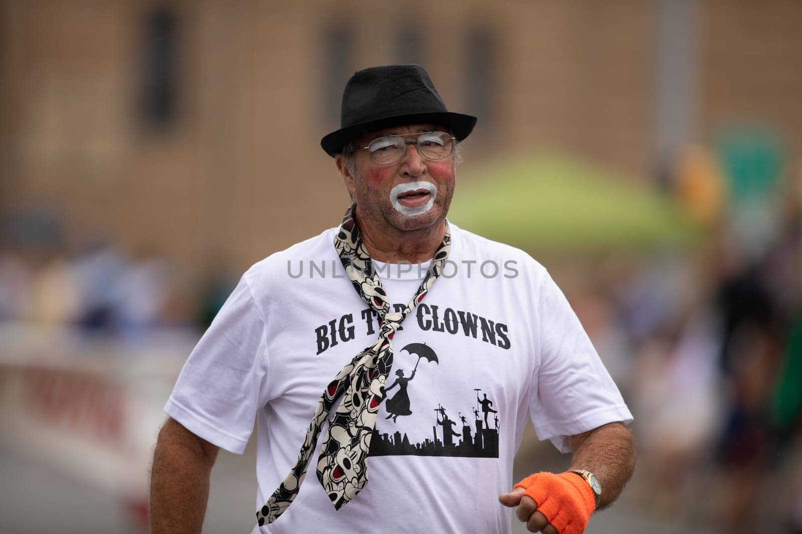 Peru, Indiana, USA - July 21, 2018 Men women and children dress up as clowns going down the road at the Circus City Festival Parade