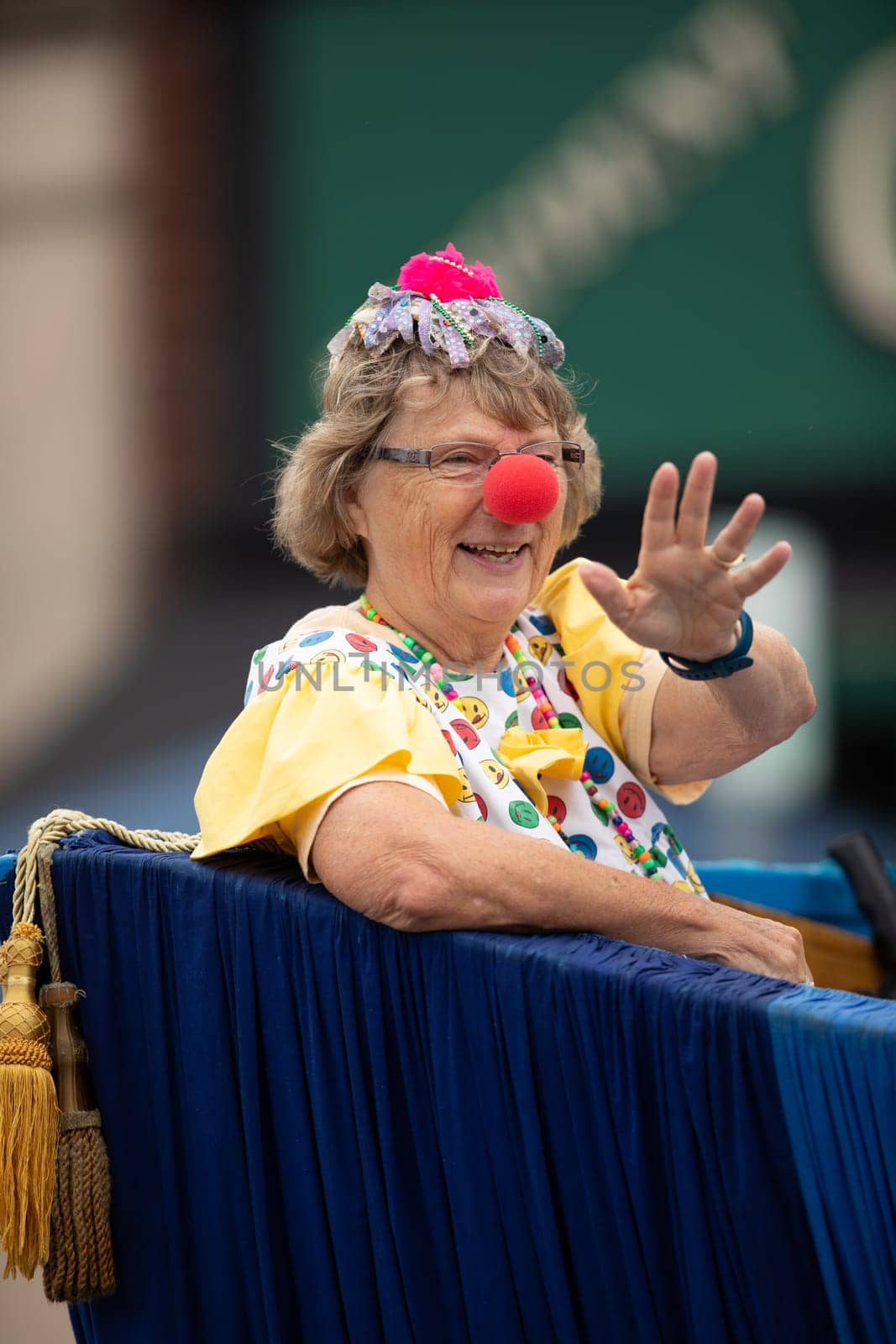 Peru, Indiana, USA - July 21, 2018 Woman wearing a clown outfit at the Circus City Festival Parade