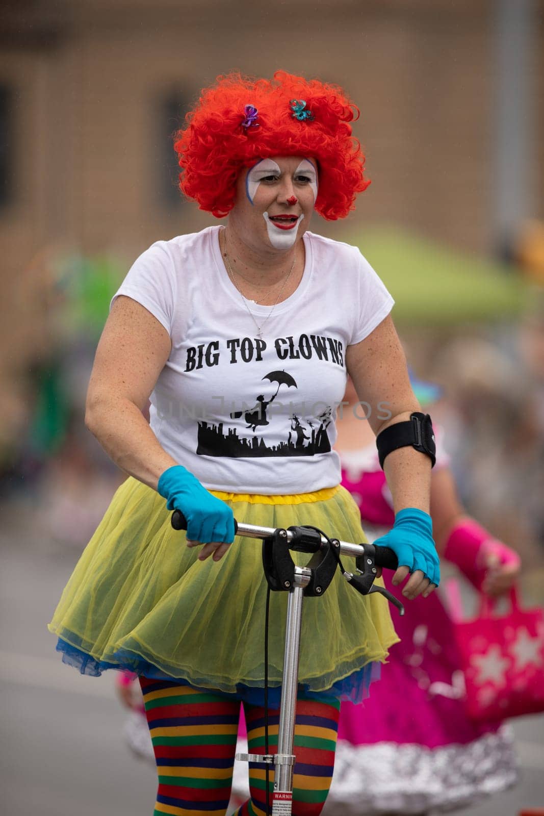 Peru, Indiana, USA - July 21, 2018 Men women and children dress up as clowns going down the road at the Circus City Festival Parade