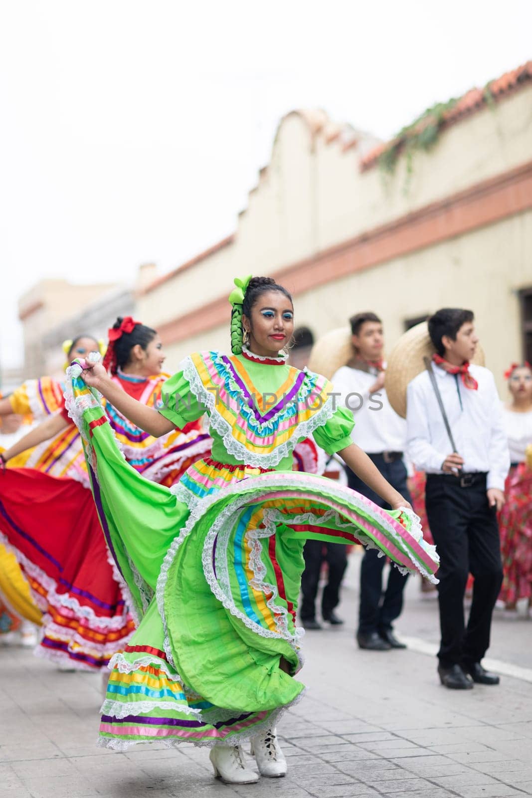 Matamoros, Tamaulipas, Mexico - November 20, 2018: The November 20 Parade, Young women and men dancing wearing traditional mexican clothing during the parade