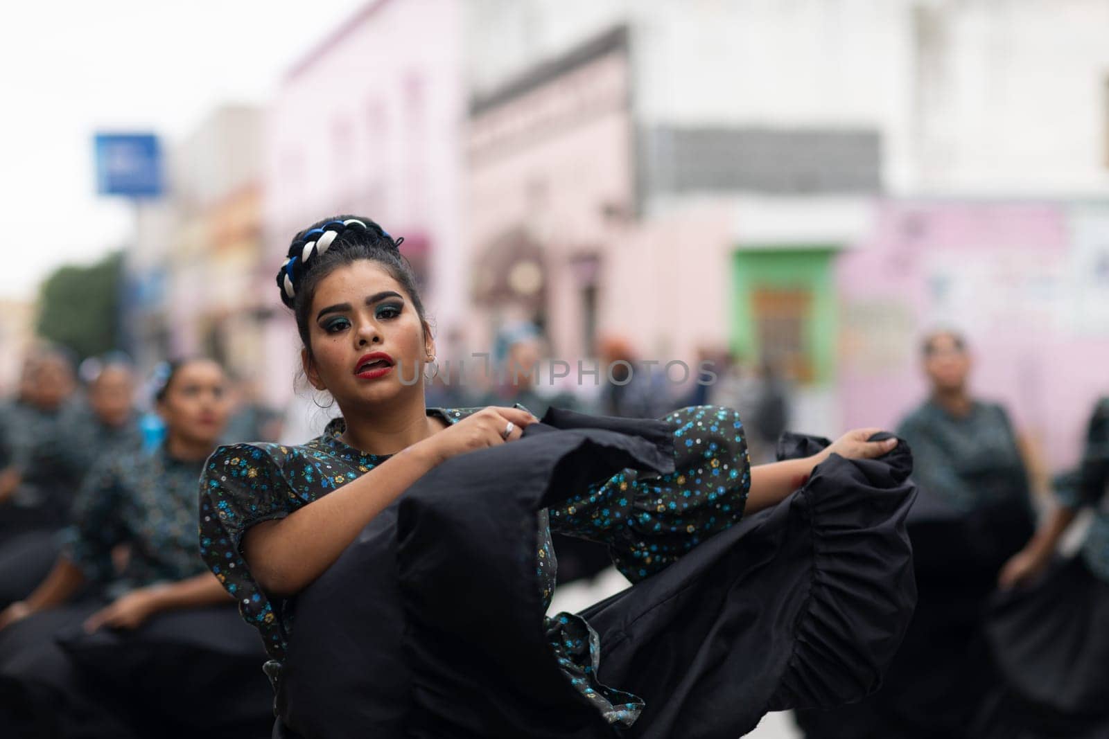 Matamoros, Tamaulipas, Mexico - November 20, 2018: The November 20 Parade, Young women wearing traditional mexican clothing dancing at the parade