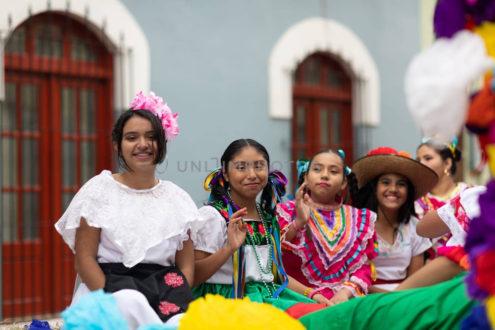 Matamoros, Tamaulipas, Mexico - November 20, 2018: The November 20 Parade, Young girls wearing traditional mexican clothing going down the road on a float