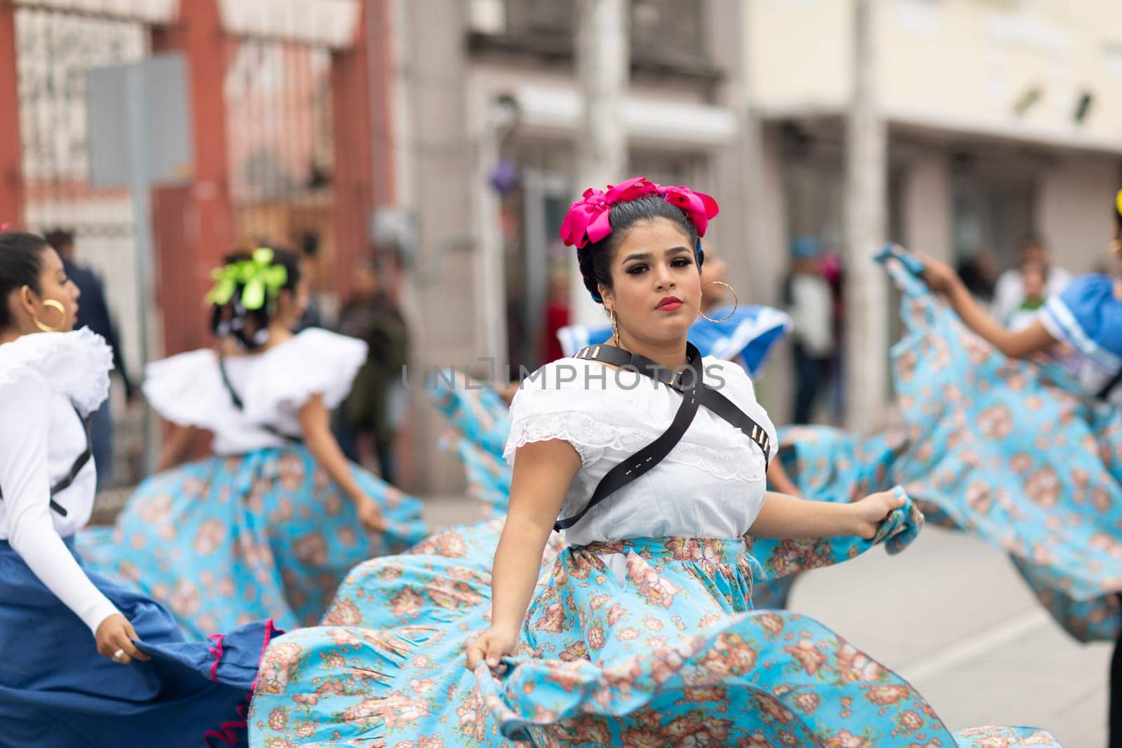 Matamoros, Tamaulipas, Mexico - November 20, 2018: The November 20 Parade, Young women wearing traditional mexican clothing dancing at the parade