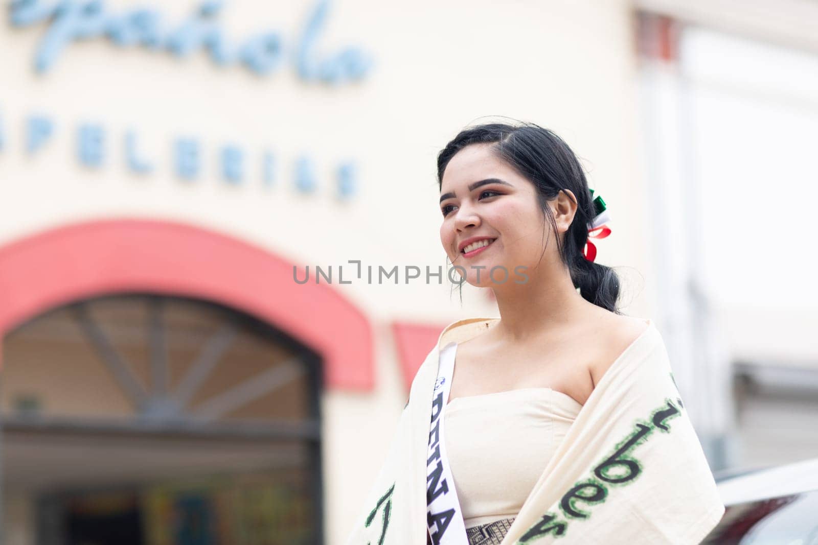 Matamoros, Tamaulipas, Mexico - November 20, 2018: The November 20 Parade, Young Mexican woman wearing traditional mexican clothing going down the road during the parade