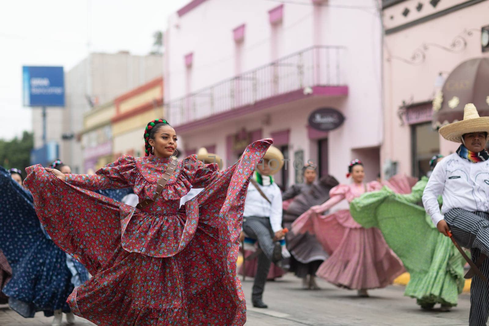 Matamoros, Tamaulipas, Mexico - November 20, 2018: The November 20 Parade, Young women and men dancing wearing traditional mexican clothing during the parade