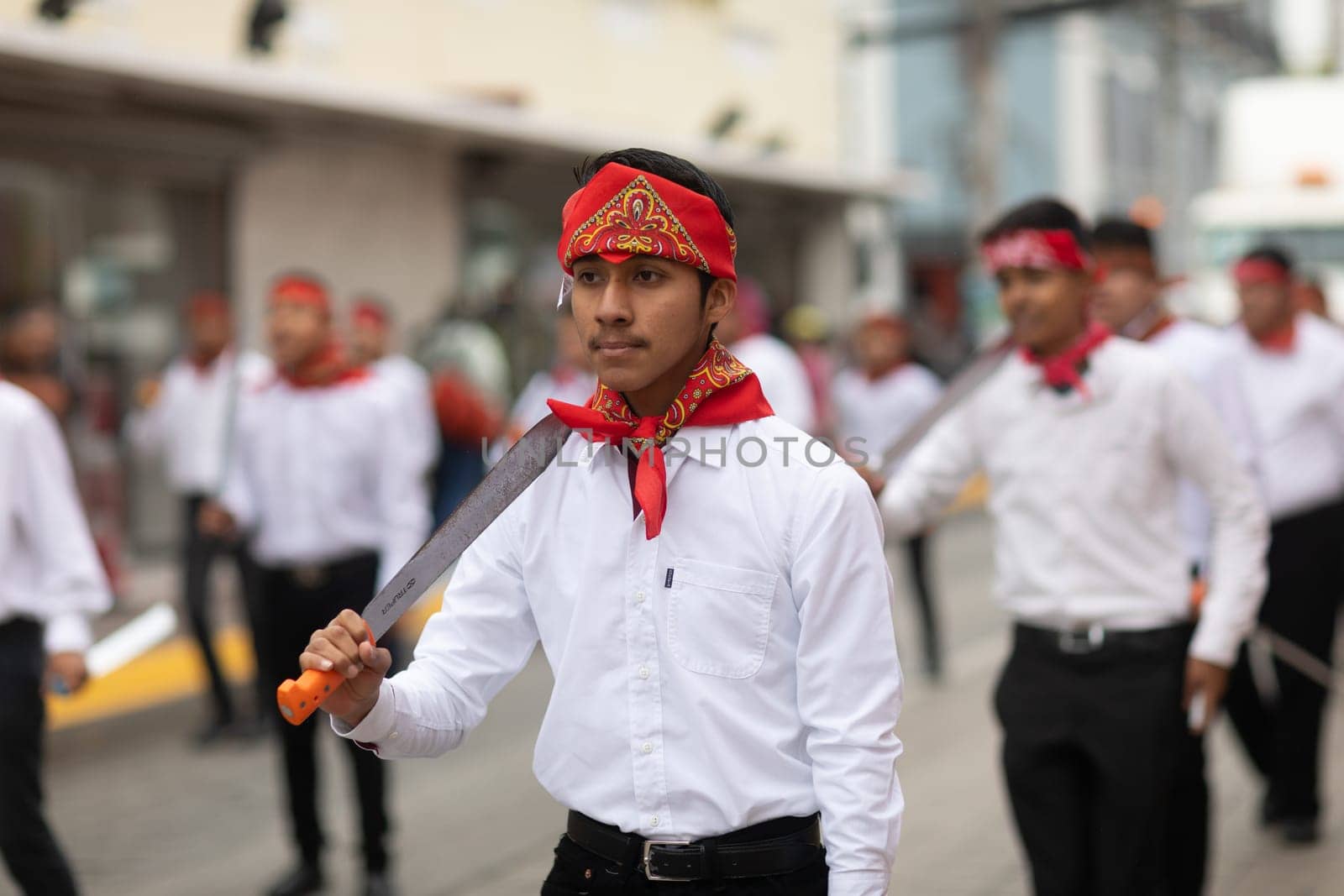 Matamoros, Tamaulipas, Mexico - November 20, 2018: The November 20 Parade, Young men wearing traditional mexican clothing dancing with machetes