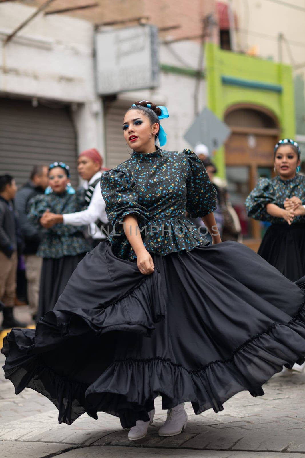 Matamoros, Tamaulipas, Mexico - November 20, 2018: The November 20 Parade, Young women wearing traditional mexican clothing dancing at the parade