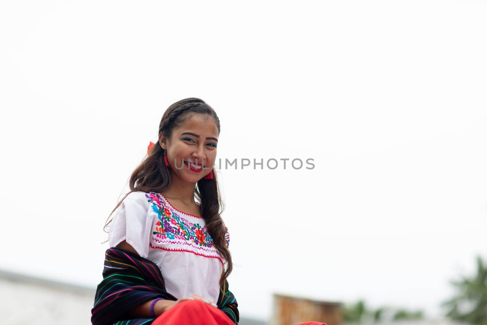 Matamoros, Tamaulipas, Mexico - November 20, 2018: The November 20 Parade, Young Mexican woman wearing traditional mexican clothing going down the road during the parade