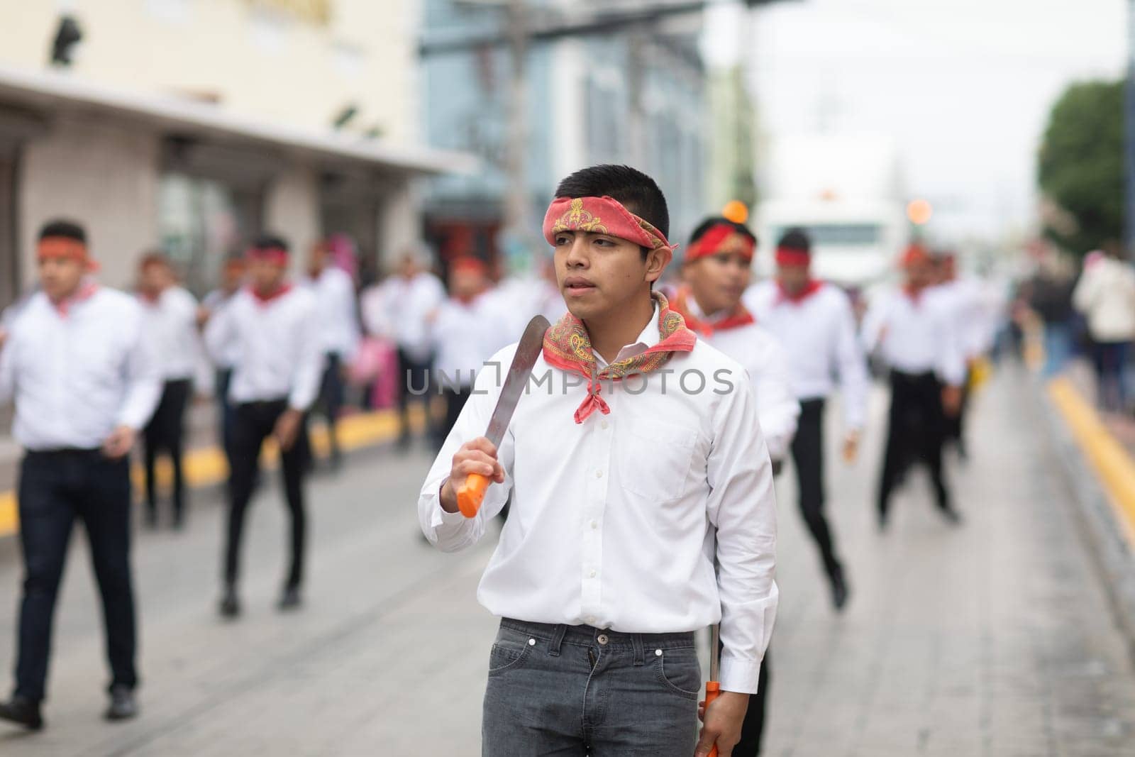 Matamoros, Tamaulipas, Mexico - November 20, 2018: The November 20 Parade, Young men wearing traditional mexican clothing dancing with machetes