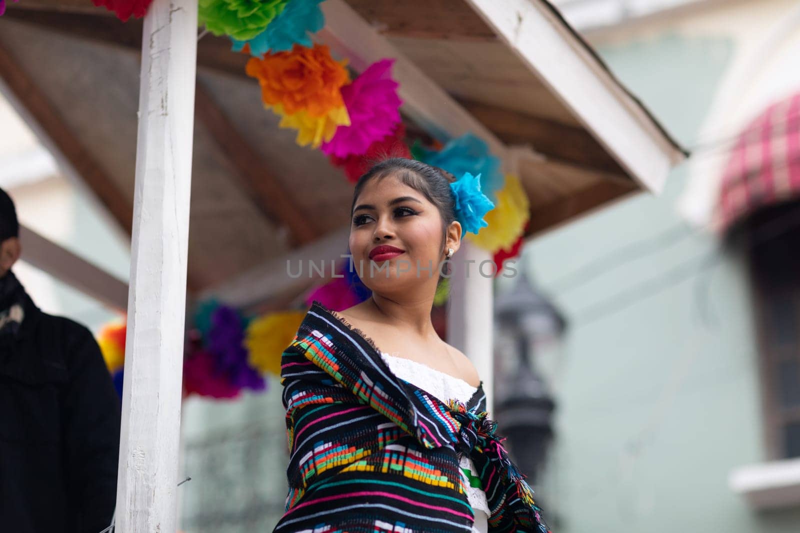 Matamoros, Tamaulipas, Mexico - November 20, 2018: The November 20 Parade, Young Mexican woman wearing traditional mexican clothing going down the road during the parade