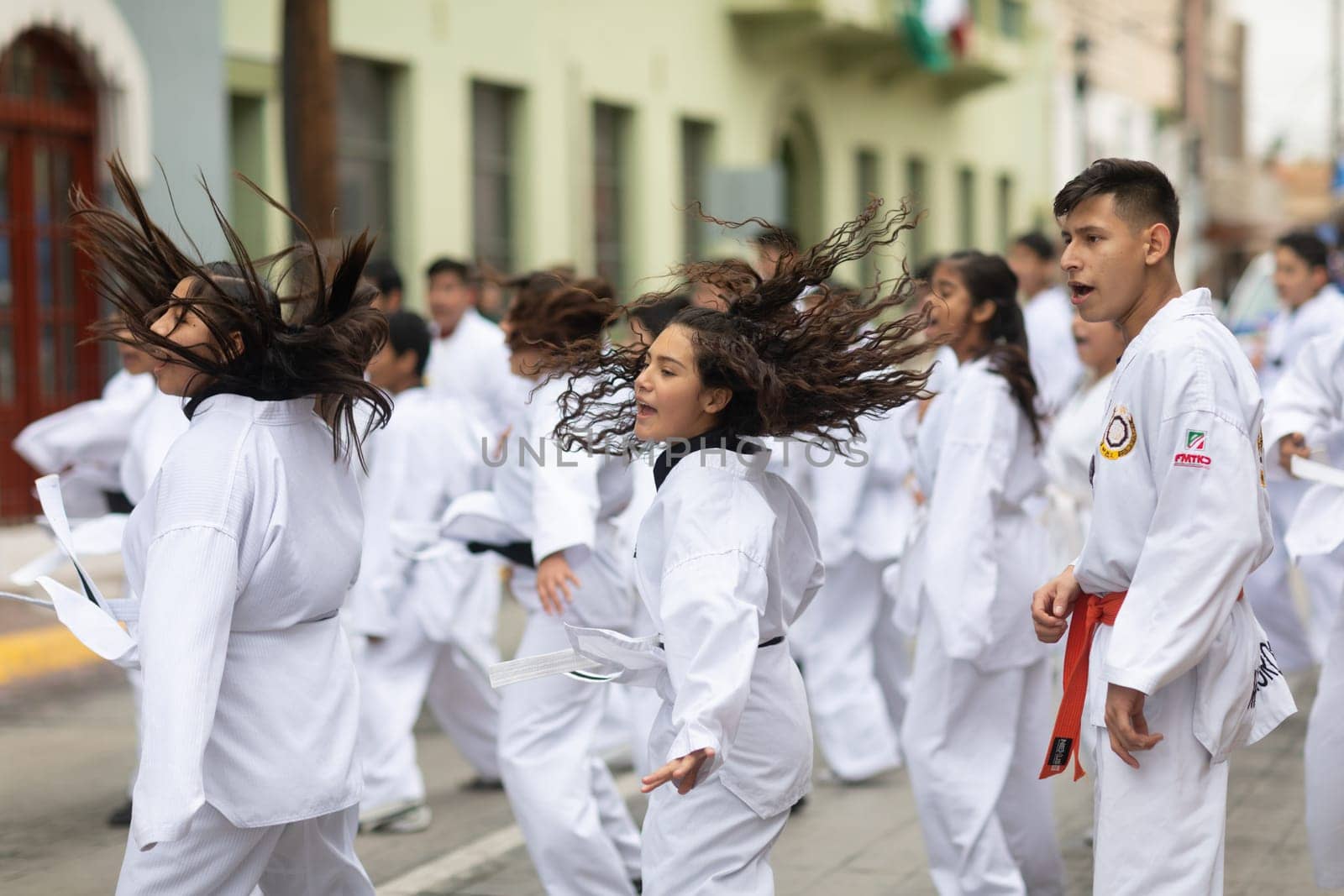 Matamoros, Tamaulipas, Mexico - November 20, 2018: The November 20 Parade, Young men and women practicing martial arts during the parade