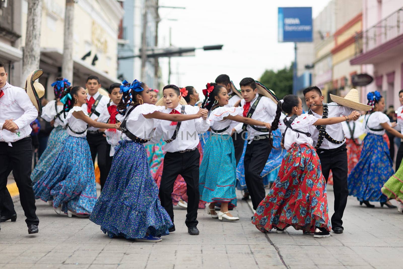 Matamoros, Tamaulipas, Mexico - November 20, 2018: The November 20 Parade, Young women and men dancing wearing traditional mexican clothing during the parade