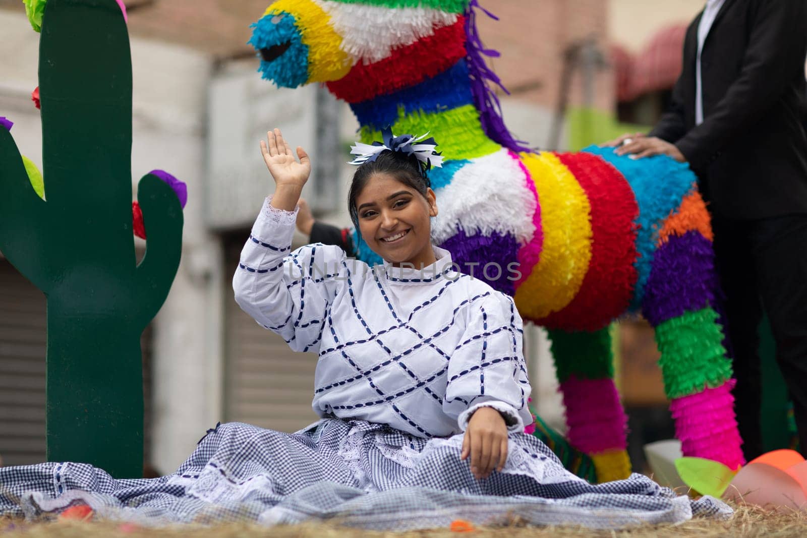 Matamoros, Tamaulipas, Mexico - November 20, 2018: The November 20 Parade, Young Mexican woman wearing traditional mexican clothing going down the road during the parade