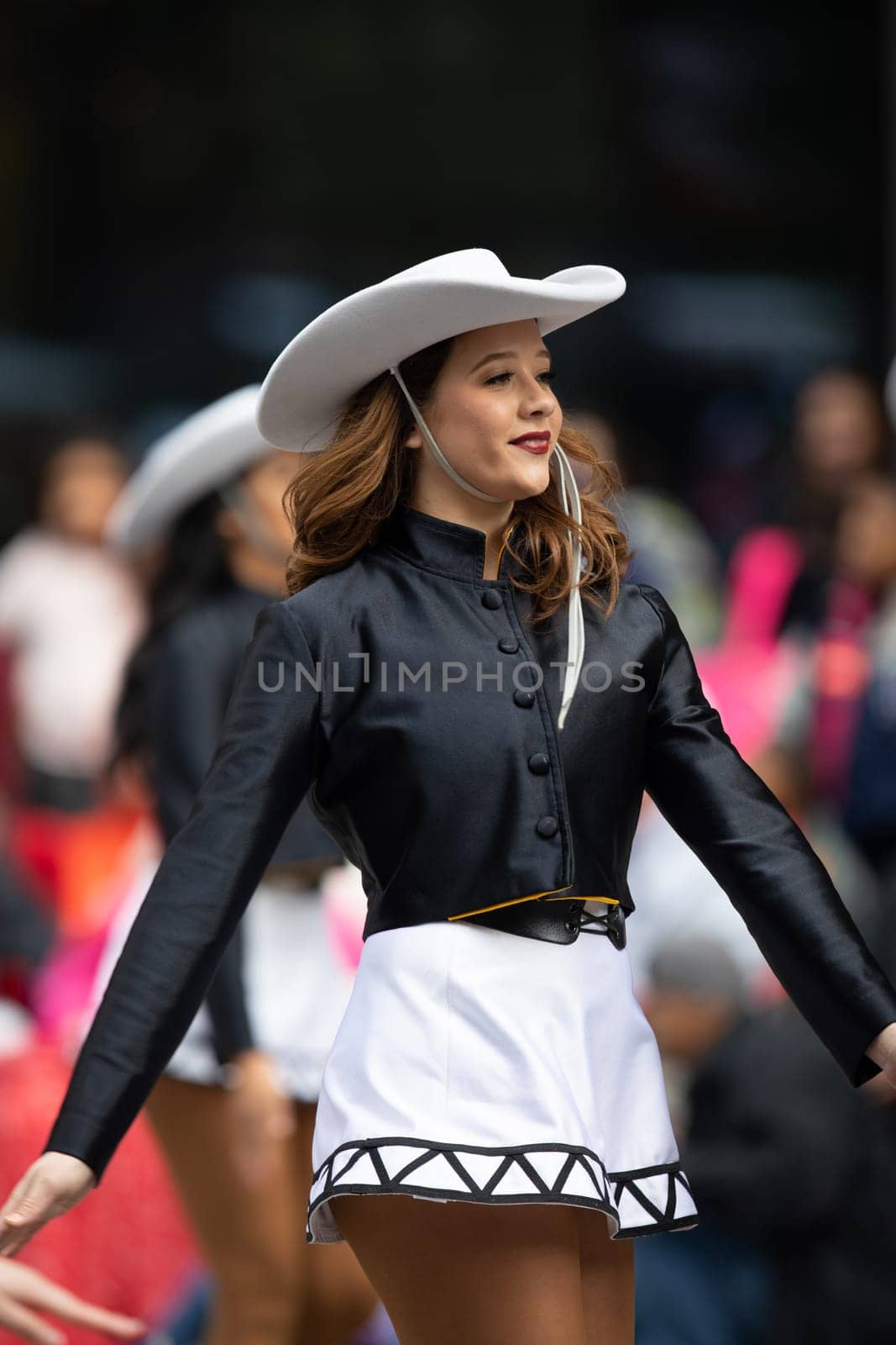 Houston, Texas, USA - November 22, 2018 The H-E-B Thanksgiving Day Parade, The Apache Belles from Tyler Junior College, from Tyler, Texas, Dancing wearing a cowgirl outfit