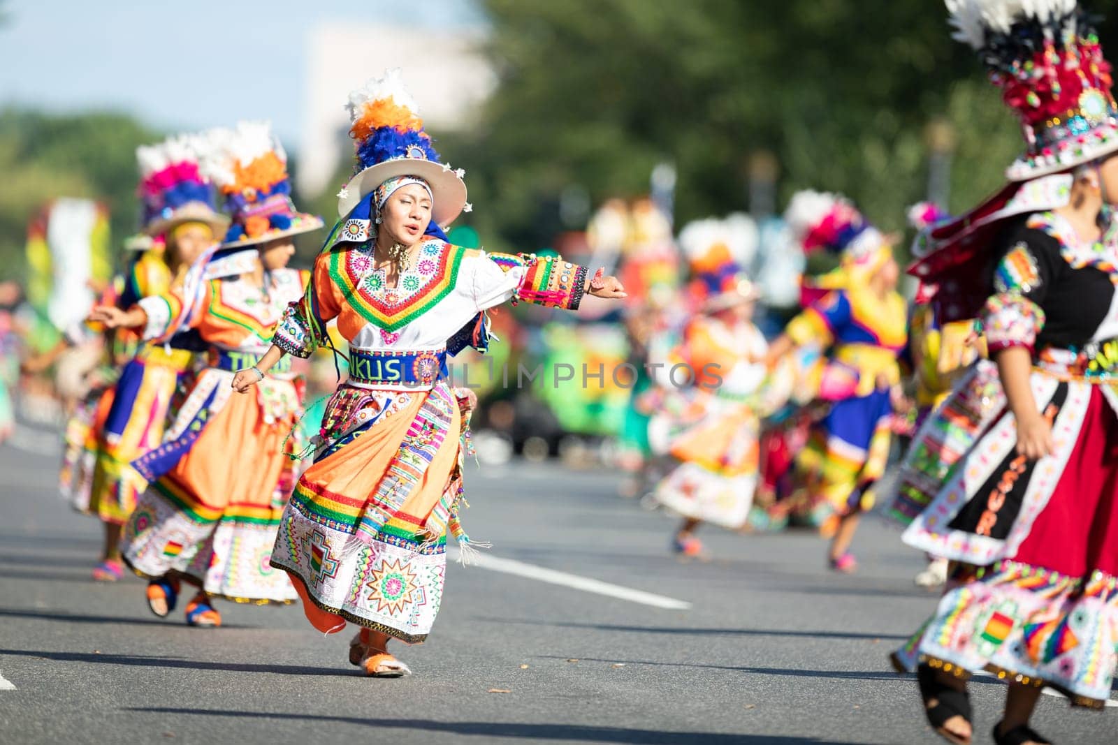 Washington, D.C., USA - September 29, 2018: The Fiesta DC Parade, Bolivian women wearing traditional clothing performing a traditional dance from bolivia