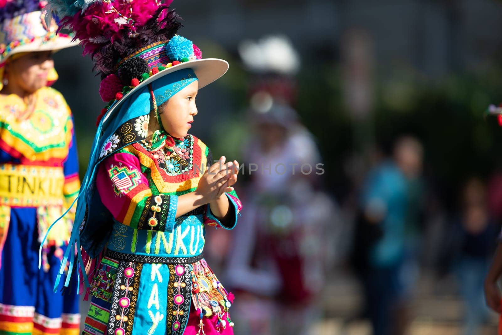 Washington, D.C., USA - September 29, 2018: The Fiesta DC Parade, children from bolivia wearing traditional clothing walking down the street during the parade