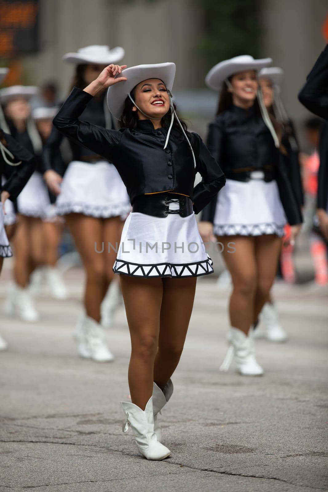 Houston, Texas, USA - November 22, 2018 The H-E-B Thanksgiving Day Parade, The Apache Belles from Tyler Junior College, from Tyler, Texas, Dancing wearing a cowgirl outfit