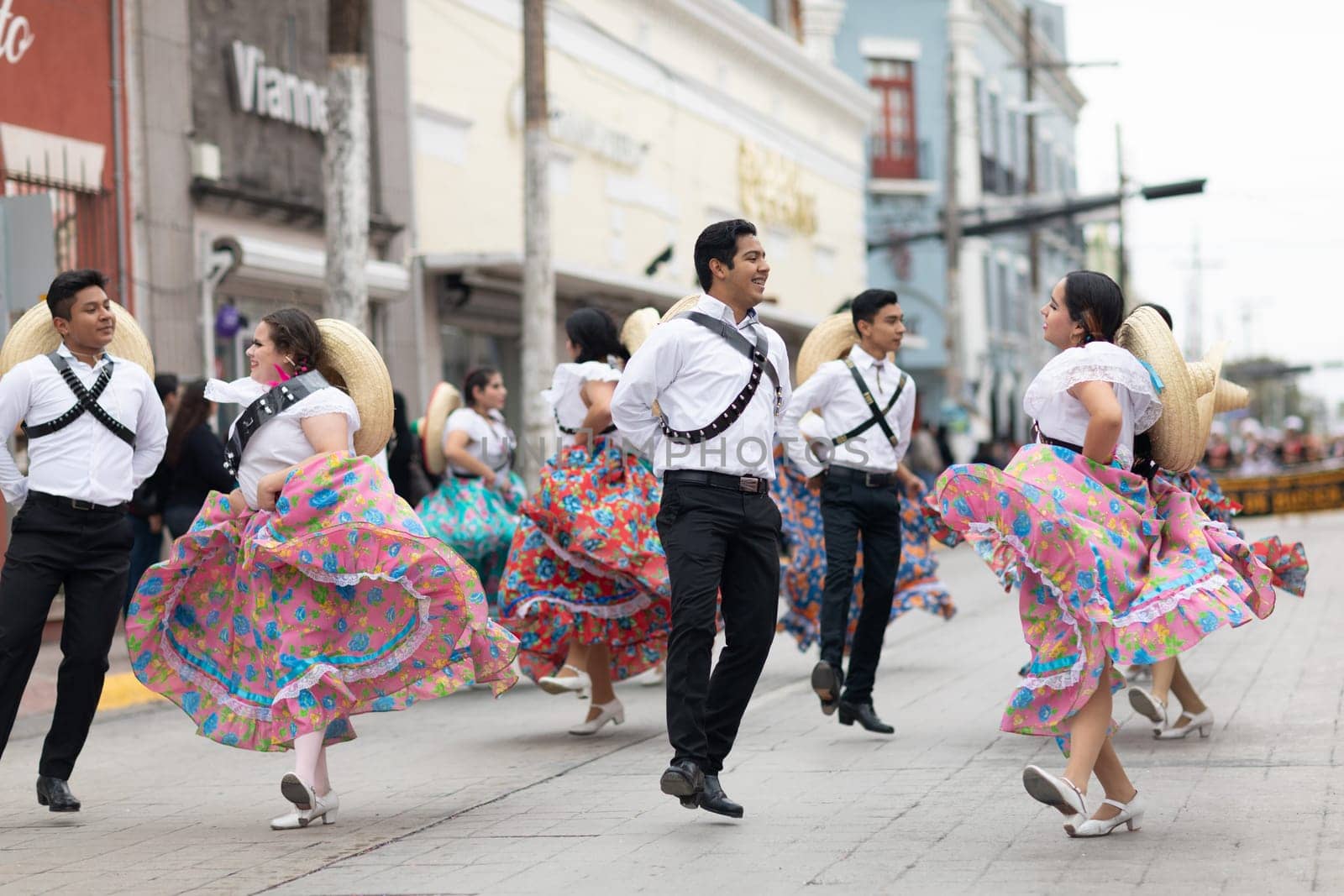 Matamoros, Tamaulipas, Mexico - November 20, 2018: The November 20 Parade, Young women and men dancing wearing traditional mexican clothing during the parade