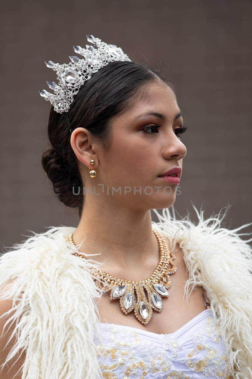 Houston, Texas, USA - November 22, 2018 The H-E-B Thanksgiving Day Parade, Latina Beauty queen, with a white dress and a crown