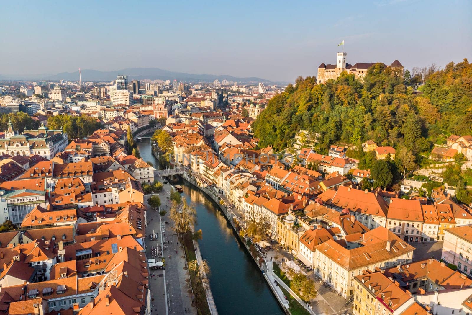 Aerial panoramic view of Ljubljana, capital of Slovenia in warm afternoon sun.