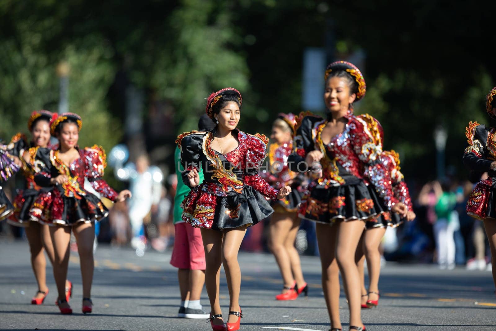 Washington, D.C., USA - September 29, 2018: The Fiesta DC Parade, Bolivian women wearing traditional clothing performing a traditional dance from bolivia