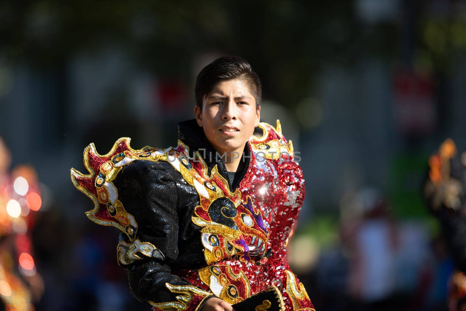 Washington, D.C., USA - September 29, 2018: The Fiesta DC Parade, Bolivian men wearing traditional clothing performing a traditional Bolivian dance