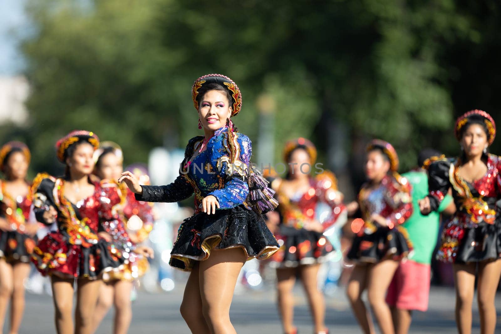 Washington, D.C., USA - September 29, 2018: The Fiesta DC Parade, Bolivian women wearing traditional clothing performing a traditional dance from bolivia