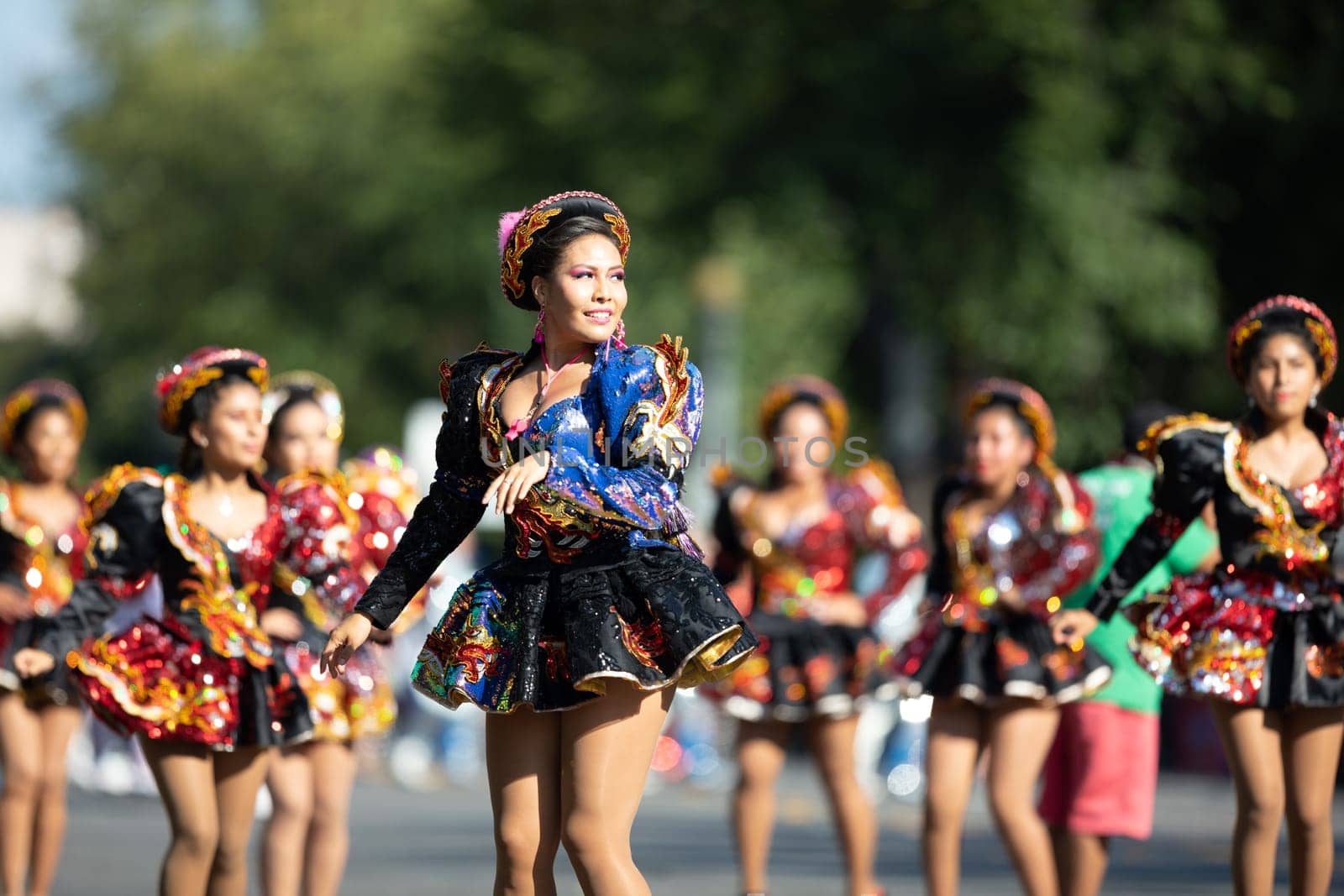 Washington, D.C., USA - September 29, 2018: The Fiesta DC Parade, Bolivian women wearing traditional clothing performing a traditional dance from bolivia