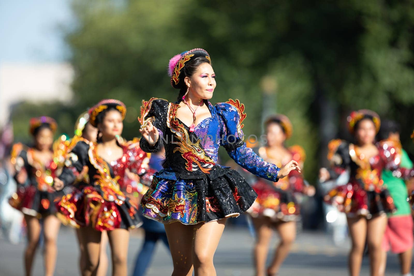 Washington, D.C., USA - September 29, 2018: The Fiesta DC Parade, Bolivian women wearing traditional clothing performing a traditional dance from bolivia